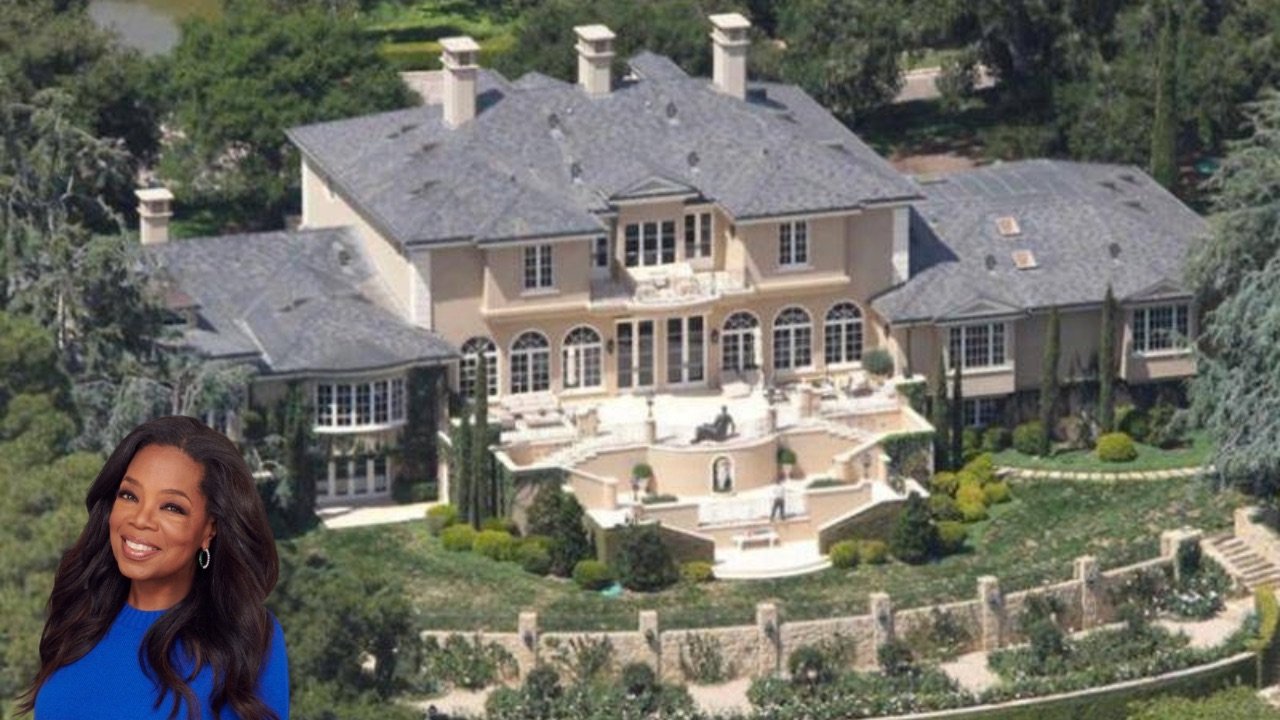 A grand view of Oprah's mansion, now on the market for $100 million, showcasing its opulence and expansive grounds.