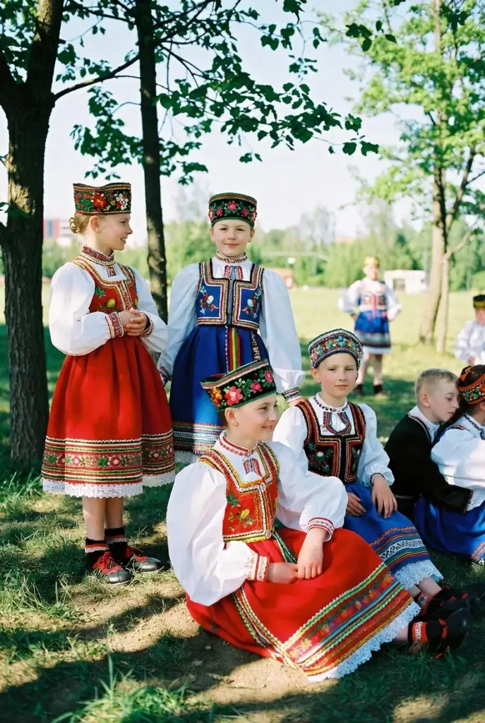 Polish Highlander man wearing Podhale regional outfit with wool coat and leather belt